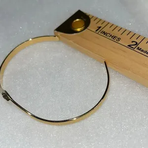 Avon gold tone V shaped cuff bracelet with faux ruby or garnet. Large thumbnail 6