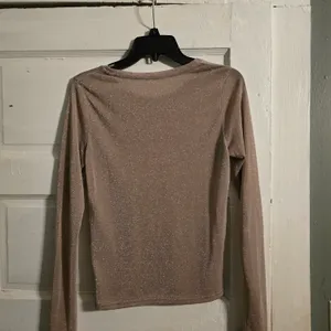 FREE PEOPLE Shimmery Long-Sleeve Crewneck Top in Dusty Blush thumbnail 3