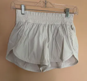 lululemon athletica Off-White Smocked Waist Running Shorts thumbnail 1