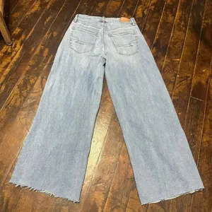 American Eagle distressed 0 low rise ultra flare raw hem jeans thumbnail 2