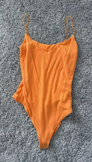 Garage orange body suit thumbnail 1