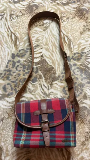Ciesta red, blue, and beige plaid crossbody bag with leather accents thumbnail 1