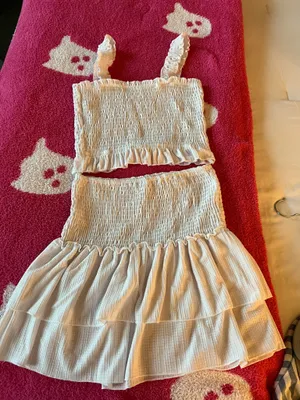 Lulus Chic white smocked two-piece set with ruffle details. Perfect for a stylish look. thumbnail 1