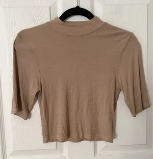 Enza Costa Tan Ribbed Cropped Mock Neck Tee medium. thumbnail 1