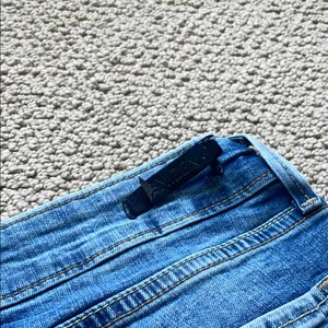 Denizen from Levi's Distressed Blue Low Rise Jeans thumbnail 10