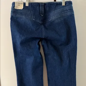 Free people still water low rise slim flare jean thumbnail 6