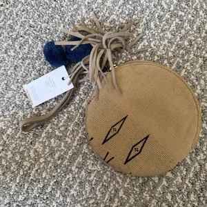 Bloom & Give Tan Round Mini Wristlet with Tassel & Pom Pom’s thumbnail 4