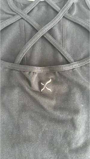 Capezio black tank top with cut out design on back. Size large child thumbnail 2