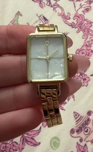 Gold watch with white face thumbnail 1