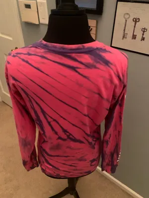 This is a pink and purple Vans tie-dye long-sleeve t-shirt featuring the brand's signature white logo on the chest. thumbnail 11