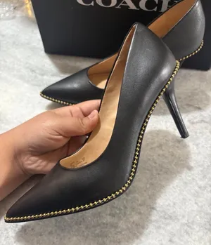 Coach black leather pointed toe pumps with gold studs along the edge, size US 6.5 thumbnail 1