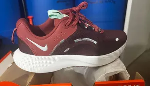 Nike women’s react escape run 2. Burgundy mint colour  thumbnail 1