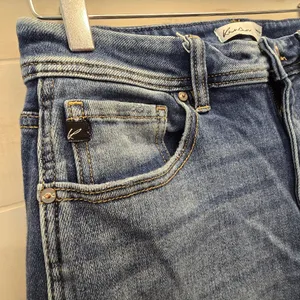{29} KanCan Distressed Blue Jean Split Flare Hem Fringe Detail thumbnail 4