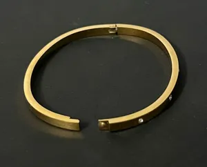 Gold stainless steel bangle with rhinestones thumbnail 1