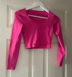Pink compression workout top thumbnail 1