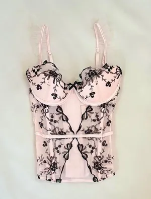 Victoria's Secret Baby pink coquette ballerina corset top with black floral and bow embroidery and ruffle details thumbnail 1