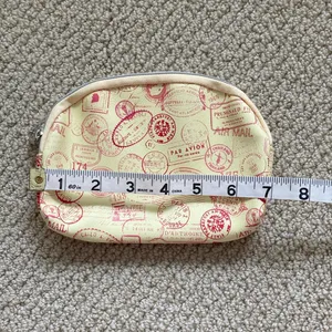Ipsy Cosmetic Case Passport Stamps Bag Yellow Orange 5” x 7” Like New thumbnail 3