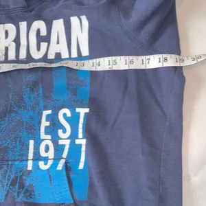 Vintage American Eagle Outfitters Navy Graphic Hoodie‎ L thumbnail 7
