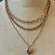 Gold tone triple chain heart locket pendant necklace