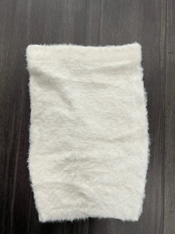 Fuzzy knit skirt in a soft white tone. Plush, textured fabric. Stretchy fit for comfort. Easy to style for layered looks or solo wear. Size small. hot & delicious - Image 3