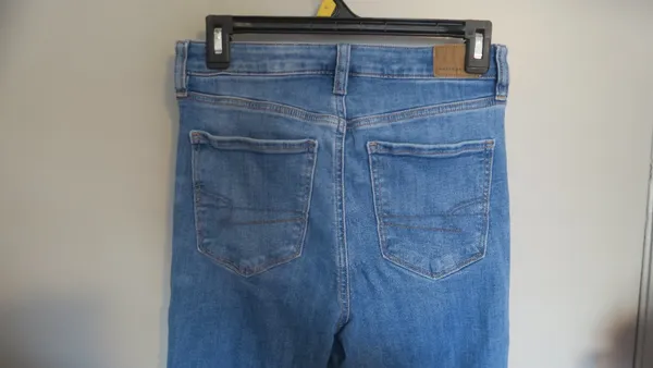 American Eagle Outfitters next level stretch super hi-rise flare jeans in medium wash blue size 4. - Image 10