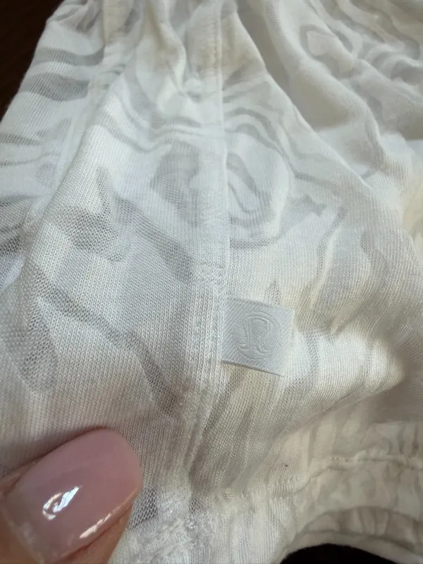 Lululemon All Yours Crop Tee in a white swirl sheer pattern - Image 4