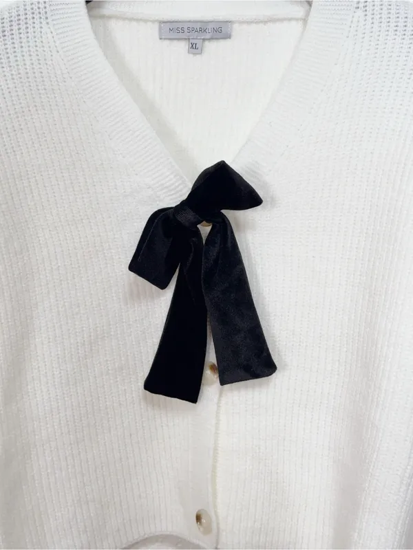Miss Sparkling White Cropped Cardigan with Removable Black Velvet Bow Pin - Image 3