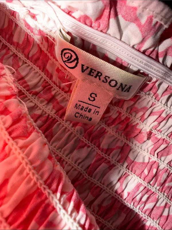 pink and white floral smocked sundress from the boutique brand Versona - Image 4
