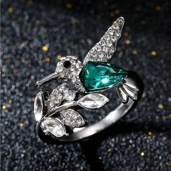 Elegant Silver Tone Hummingbird Rhinestone Ring with Green Gemstone - Image 2