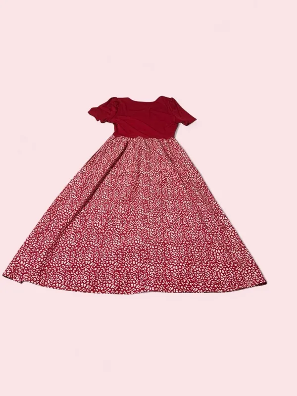 Stylish red maxi dress with a solid short-sleeve bodice and a patterned bottom - Image 2