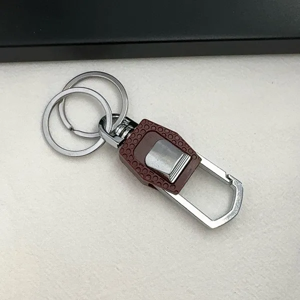 Practical carabiner keychain designed for both men and women for everyday carrying needs. Comes with double key rings, allowing you to classify and organize different keys separately. This keychain is 2.5 inches in length and 0.9 inches in width, compact and portable to carry around. Suitable for car keys, home keys, small gadgets, backpacks and handbags for convenient hanging. Simple versatile style matches various scenarios, a nice daily accessory and casual small gift. - Image 3