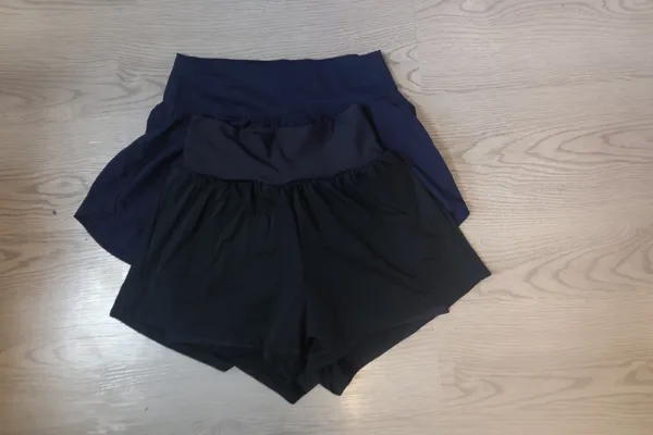 Bundle of XS's and smalls exercise workout shorts in black and navy blue. - Image 6