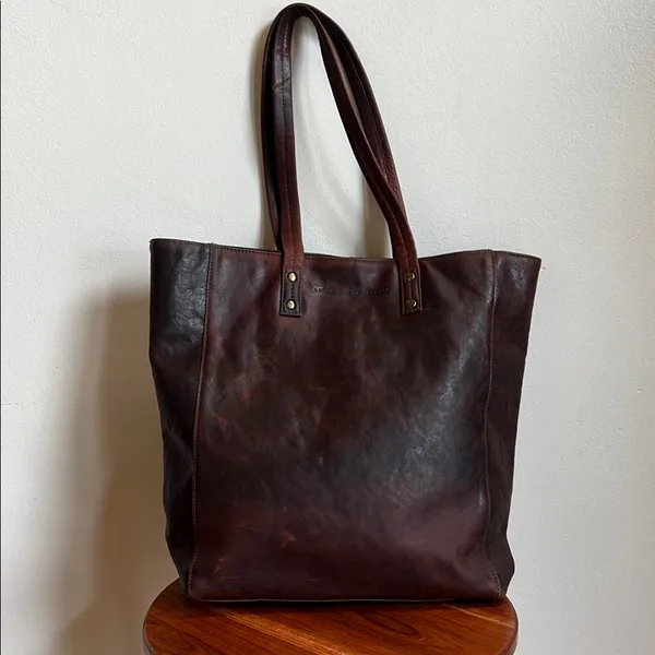 Antonio Valeria is a former Spacious Brown Leather Tote with Minimalist Design - Image 3