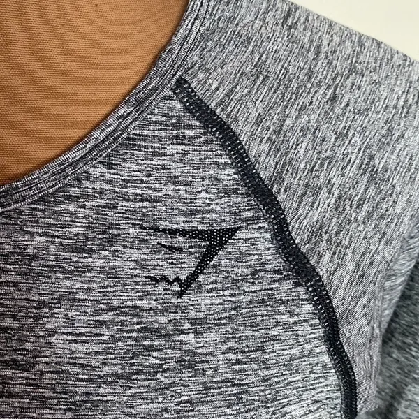 Gymshark hyper-amplify seamless long sleeve crop top in black marl size L - Image 8