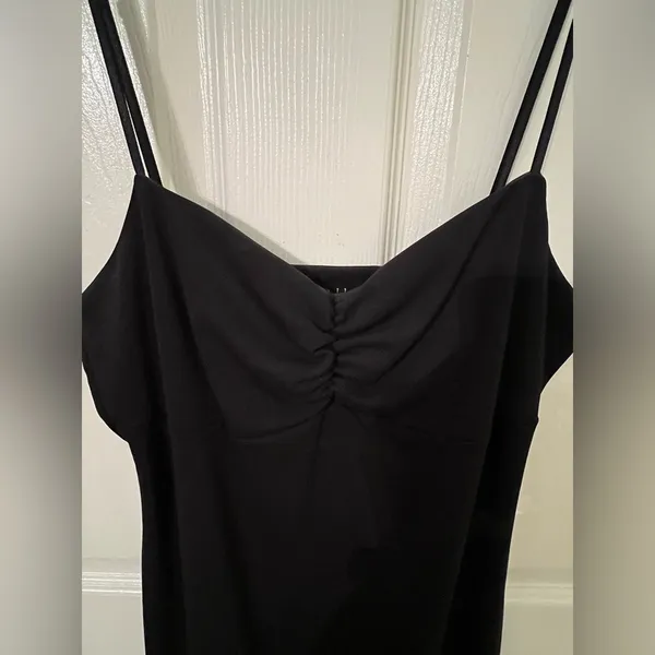 Black dress with ruffles at the bottom. - Image 3