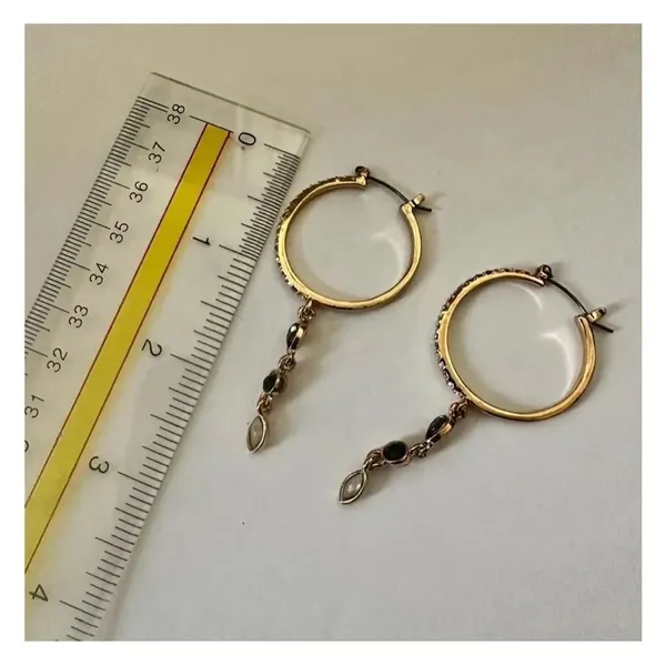 Gold tone hoop earrings with dangling rhinestones - Image 4