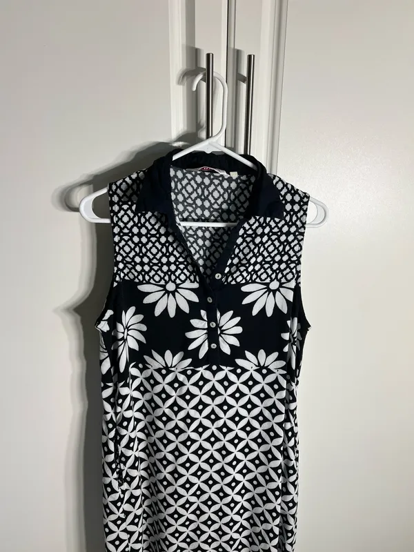 Chic sleeveless black and white dress with bold floral and geometric patterns. Lightweight and breathable for comfortable all-day wear. Collared neckline adds a polished touch and pockets. Easy to style for casual or dressy occasions. BIBA size medium - Image 2