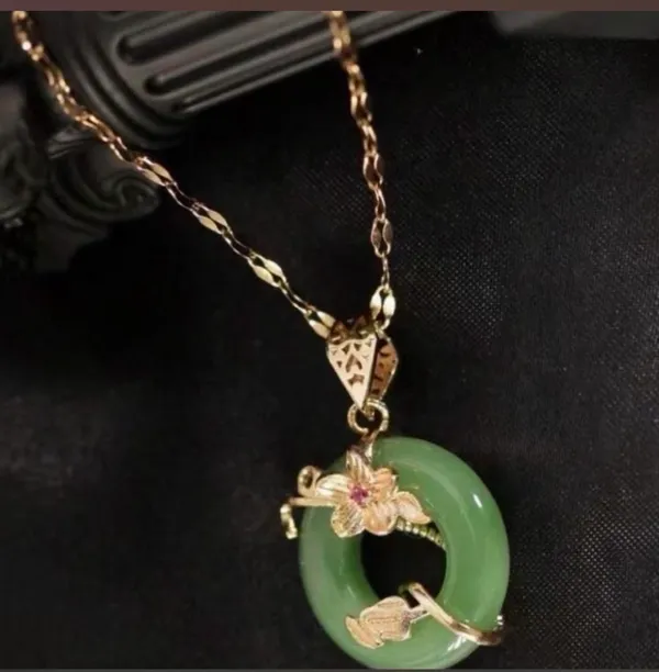 Brand New Green jade pendant with gold floral design and a small red gemstone 18 K gold plated - Image 3