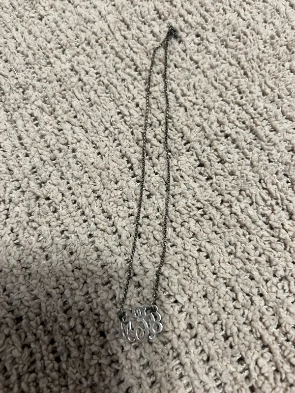Delicate silver-tone chain with a script monogram pendant. Classic and personalized style. Lightweight and elegant for everyday wear. - Image 2