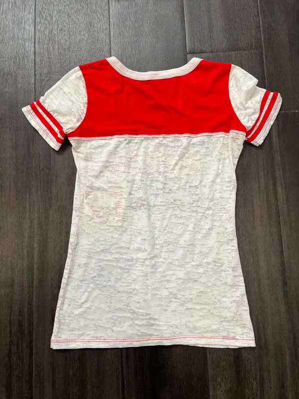 Blue 84 women’s short-sleeve tee. Bold "Nebraska Huskers" graphics with team N logo. Red yoke and sleeve accents with white body. Lightweight and fan-ready for game day. Size large - Image 3