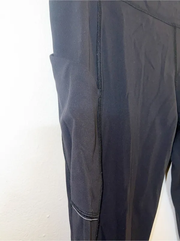 Lululemon Women’s Black Active Leggings with Side Pockets and Reflective Details - Image 5