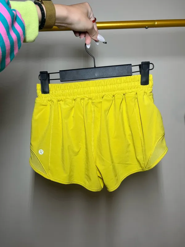 Lululemon yellow shorts with white reflective stripes #activewear #athletic - Image 2