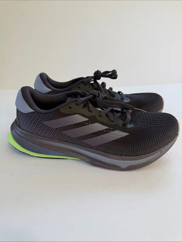adidas women’s Black Athletic Shoes with White Stripes and Neon Green Accent - Image 5