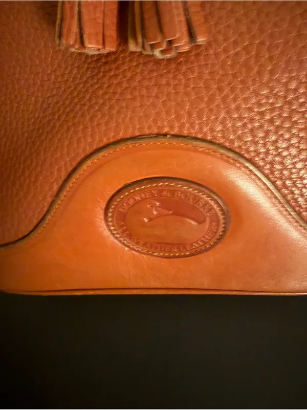Dooney & Bourke Orange Pebble Leather Bucket Bag with Tassel Drawstring - Image 3