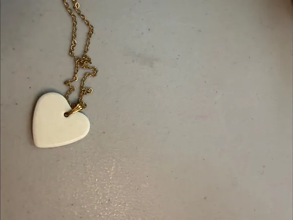 Source Unknown Gold-Tone Chain with White Heart Pendant and Butterfly Detail - Image 3