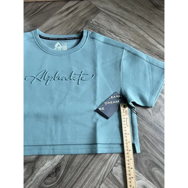 Set 2 Pcs Alphalete Women's ELMTS Short Sleeve Crop & Relaxed Coffed Jogger Teal - Image 11