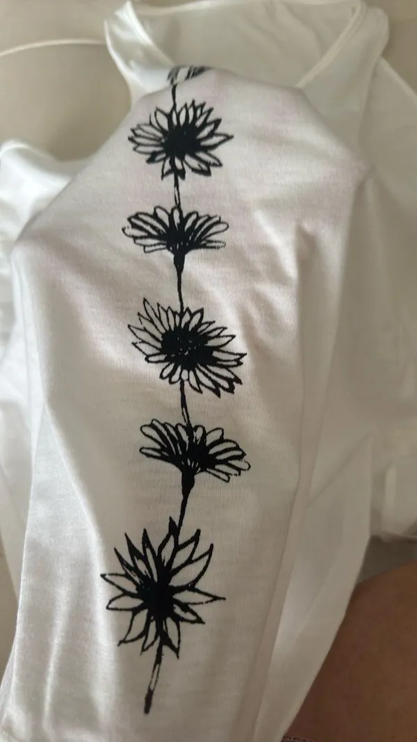 White Sleeveless Top with Black Floral Design - Image 2