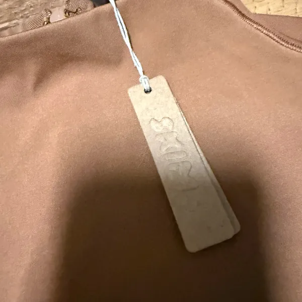 SKIMS All in One Long-Sleeve Mid Thigh Jumpsuit Onesie in Caramel new with tags - Image 8