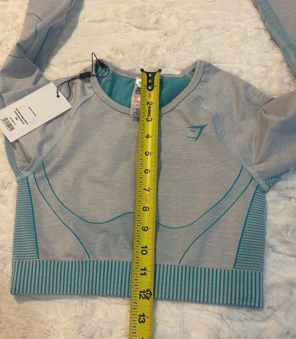 Gymshark Women's Teal and Gray Long Sleeve Crop Top Size Small . Stylish long sleeve crop top by Gymshark. Features a sleek teal and gray design. Perfect for workouts.. NWT - Image 8