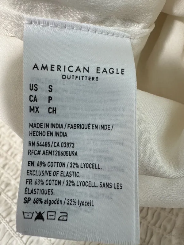 American Eagle cream romper with a tassel tie - Image 7